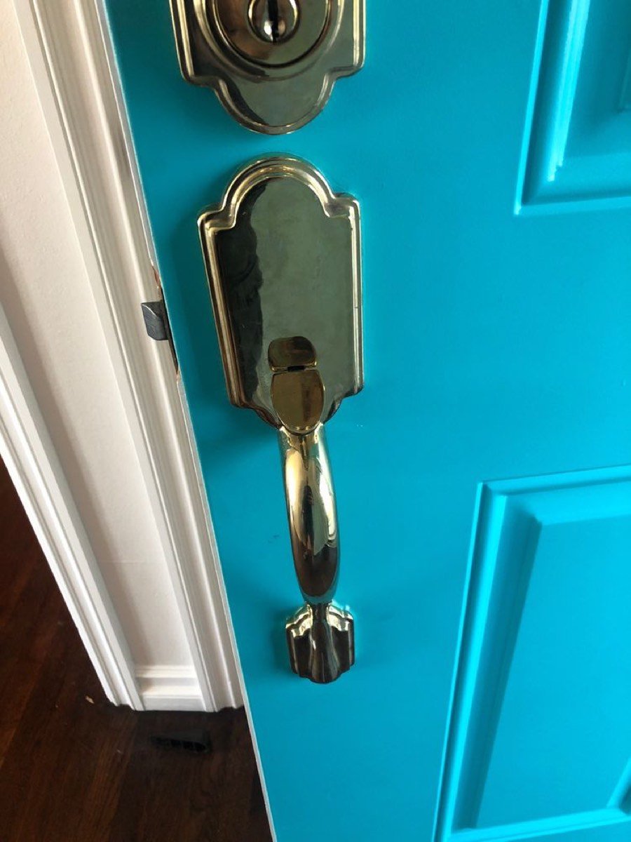 Brass deadbolt and handleset installed on a front door in Broward County